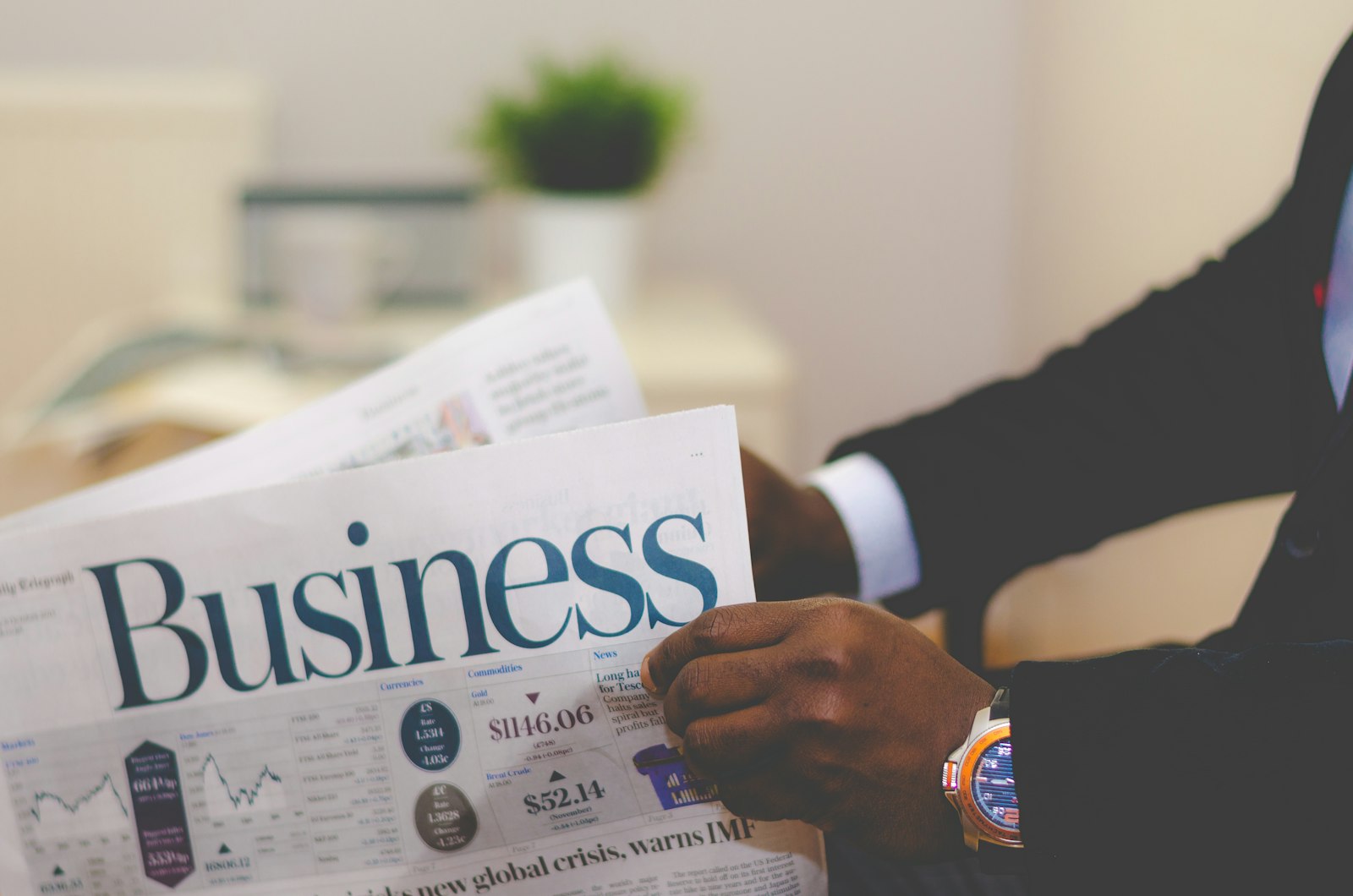 Person reviewing a business and finance report