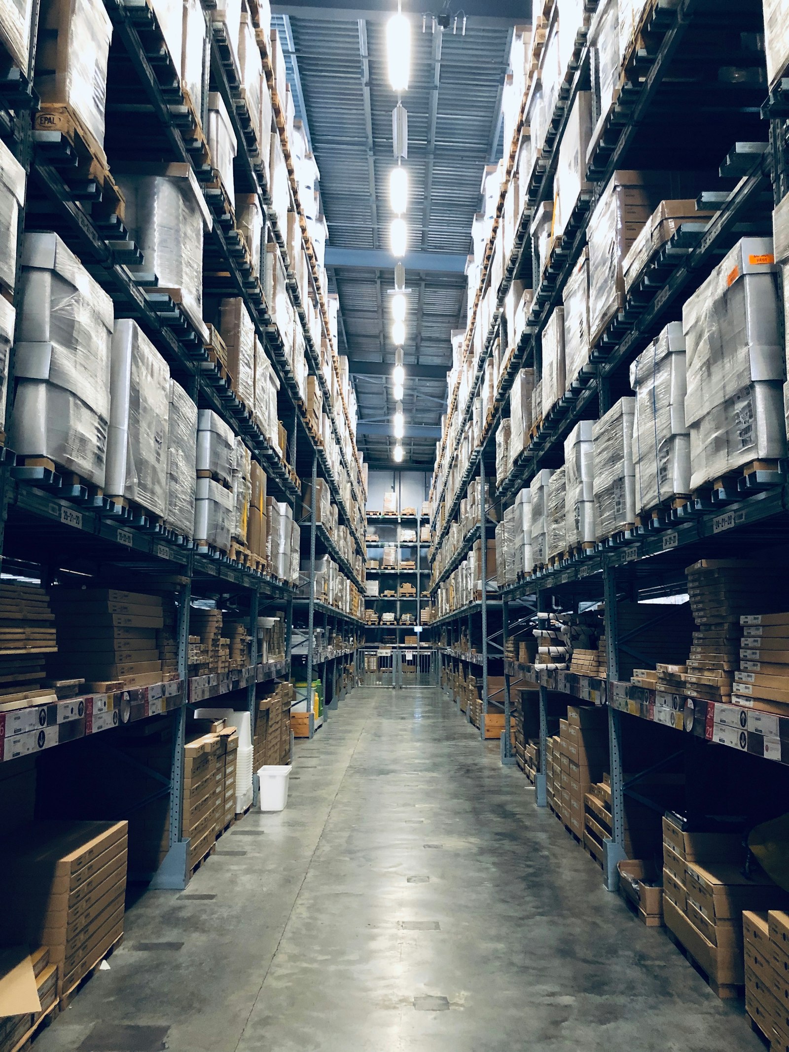 Warehouse shelving stacked with inventory